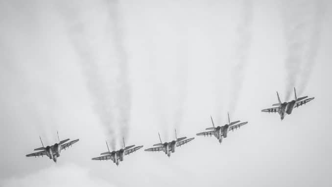 four fighter planes in mid air