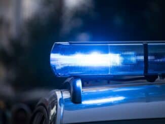 a close up of a police car with its lights on