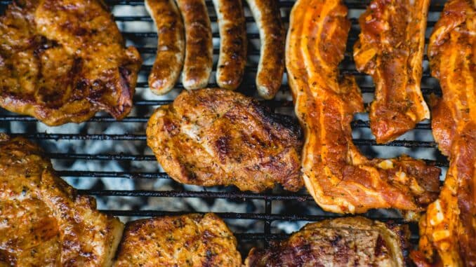 top view photo of grilling chicken and bacon