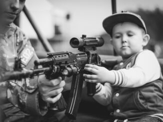 Boy Child Portrait Military Weapon  - DariuszSankowski / Pixabay