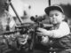 Boy Child Portrait Military Weapon  - DariuszSankowski / Pixabay