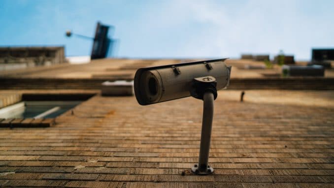 shallow focus photography of gray security camera