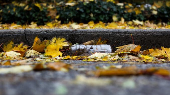 plastic bottle on pavement