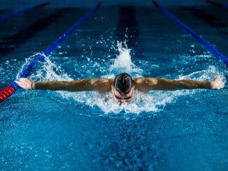 man doing butterfly stroke