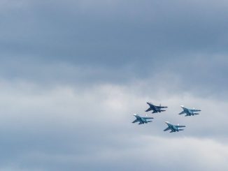 closeup photo of four fighting planes