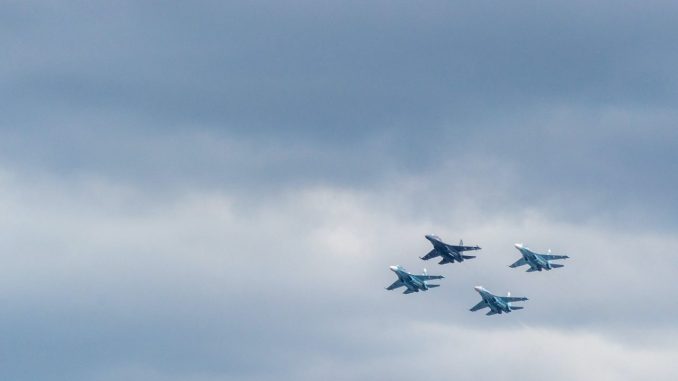 closeup photo of four fighting planes