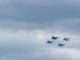closeup photo of four fighting planes