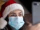 woman in white and red santa hat