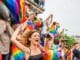 woman in red tank top raising her hands