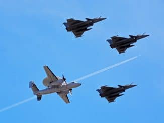 four fighter planes in mid air during daytime