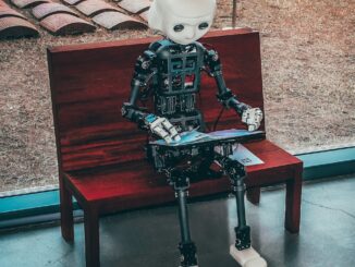 black and white robot toy on red wooden table